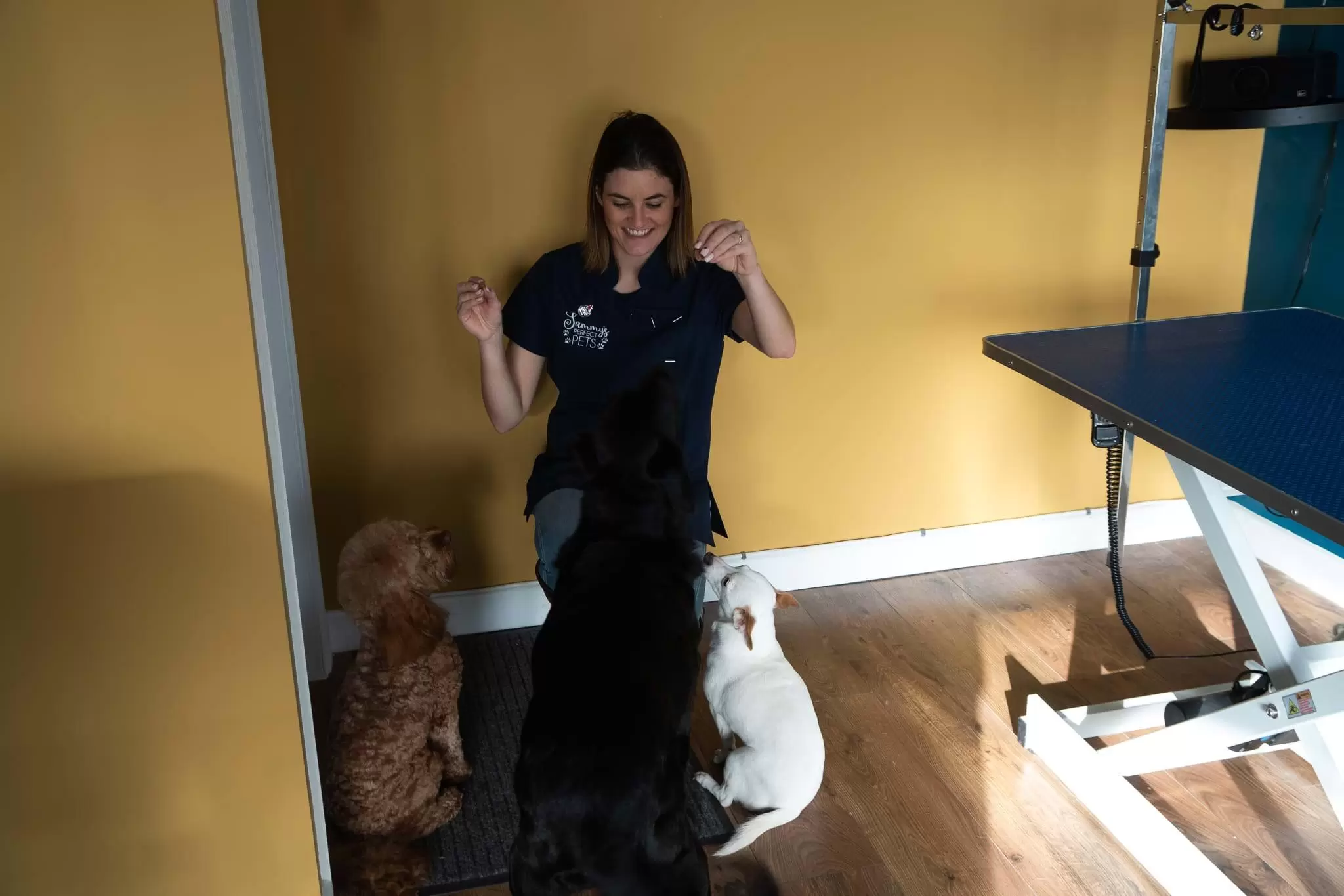 Sammy giving her dogs some treats